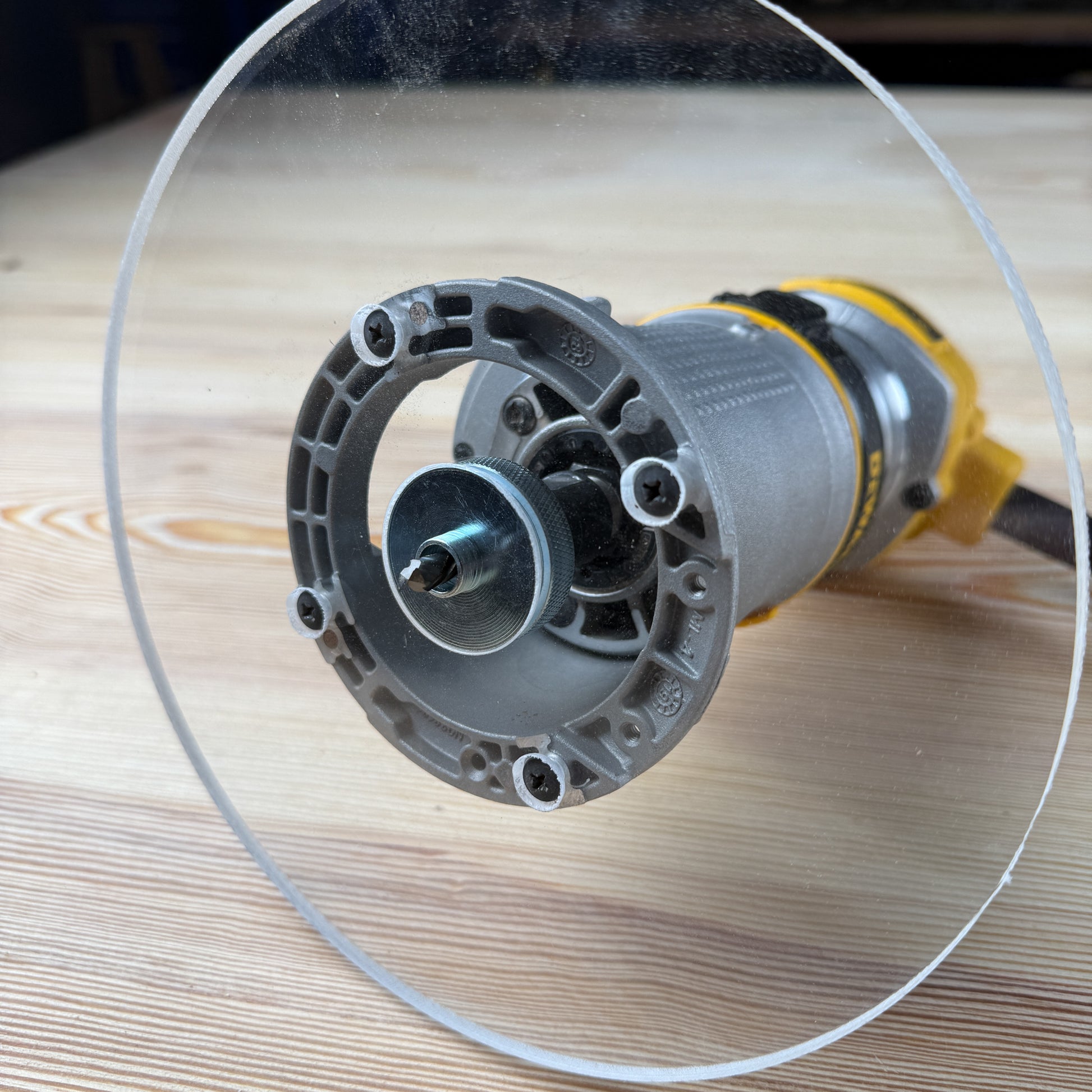 8 inch Round Router Base Plate - fits DWP611 or DCW600B - Is your factory router base not large enough? We have you covered. This is our 8 inch round router base that fits the Dewalt DWP611 or DCW600B. It's made out of 3/8" cast acrylic to be very durable! It has countersunk holes so that you can use the factory screws. It is compatible with PC-style router bushing sets. 