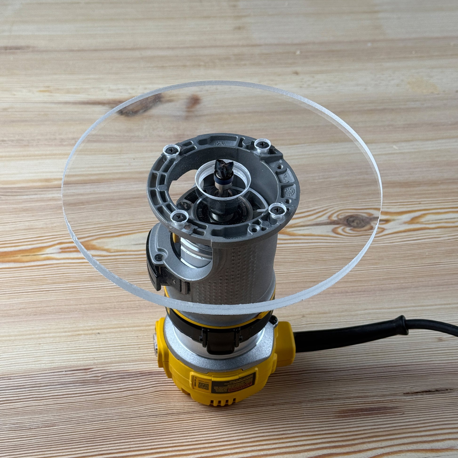 8 inch Round Router Base Plate - fits DWP611 or DCW600B - Is your factory router base not large enough? We have you covered. This is our 8 inch round router base that fits the Dewalt DWP611 or DCW600B. It's made out of 3/8" cast acrylic to be very durable! It has countersunk holes so that you can use the factory screws. It is compatible with PC-style router bushing sets. 