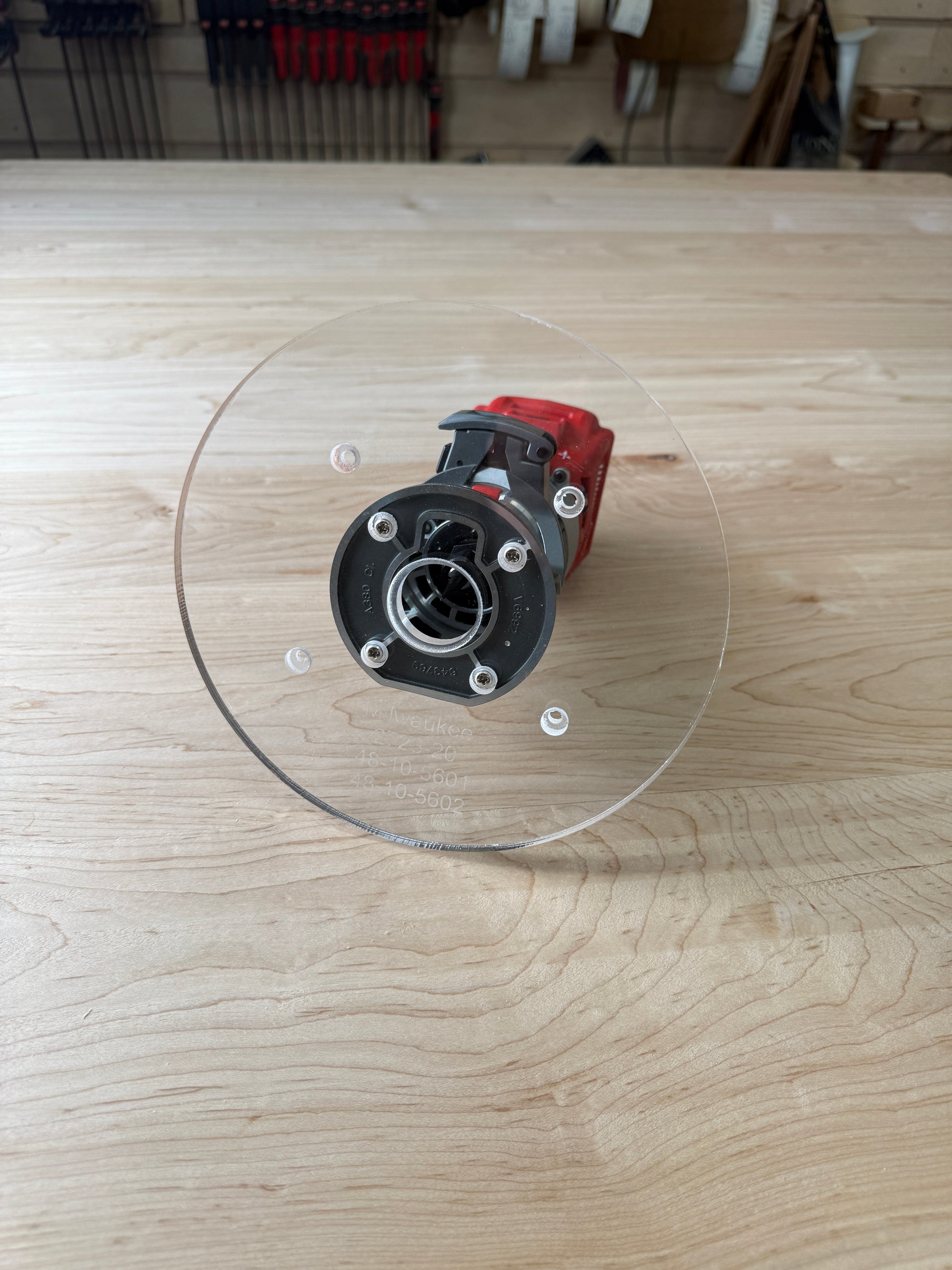 Is your factory router base not large enough? We have you covered. This is our 8 inch round router base that fits the Milwaukee Compact Trim Router also fits the plunge base. It's made out of 3/8" cast acrylic to be very durable! It has countersunk holes so that you can use the factory screws. It is compatible with PC-style router bushing sets.

It will fit the Milwaukee 2723-20 or 48-10-5601