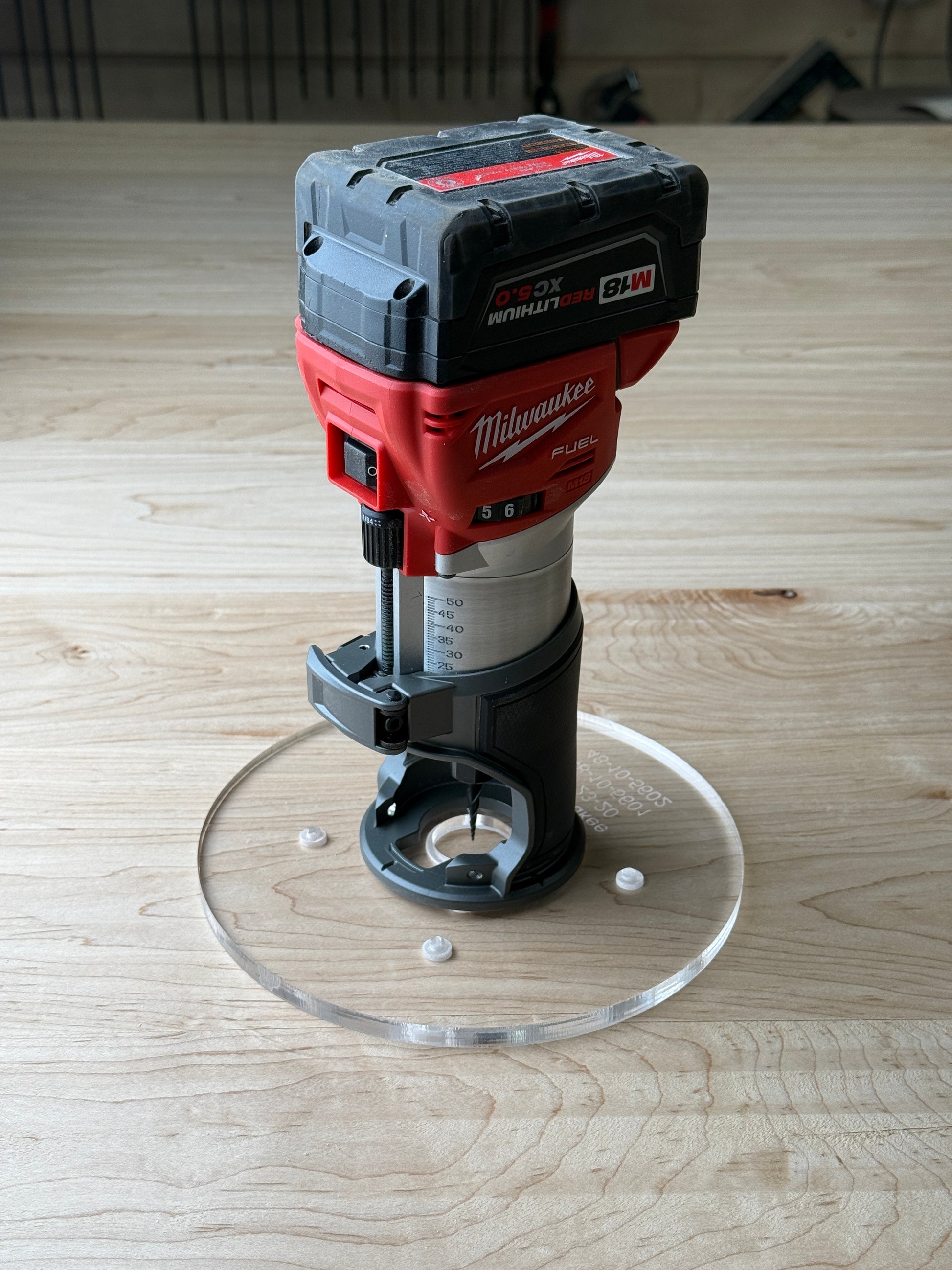 8 inch Round Router Base Plate - fits Milwaukee 2723-20 or 48-10-5601 Is your factory router base not large enough? We have you covered. This is our 8 inch round router base that fits the Milwaukee Compact Trim Router also fits the plunge base. It's made out of 3/8" cast acrylic to be very durable! It has countersunk holes so that you can use the factory screws. It is compatible with PC-style router bushing sets.

It will fit the Milwaukee 2723-20 or 48-10-5601