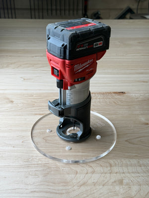8 inch Round Router Base Plate - fits Milwaukee 2723-20 or 48-10-5601 Is your factory router base not large enough? We have you covered. This is our 8 inch round router base that fits the Milwaukee Compact Trim Router also fits the plunge base. It's made out of 3/8" cast acrylic to be very durable! It has countersunk holes so that you can use the factory screws. It is compatible with PC-style router bushing sets.

It will fit the Milwaukee 2723-20 or 48-10-5601