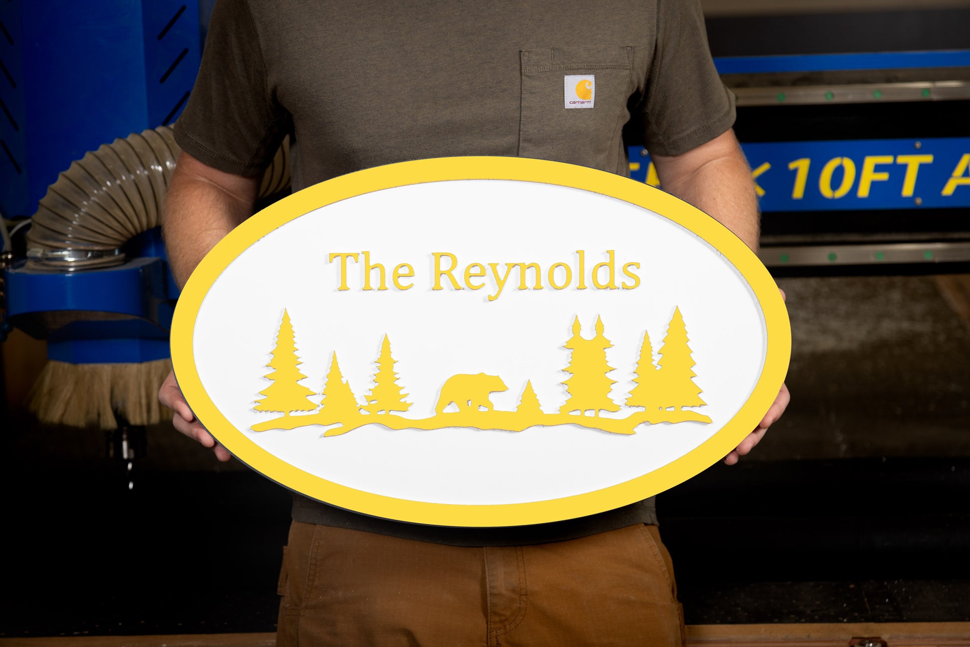 yellow oval large house sign mountain trees bear custom