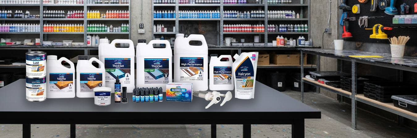 Collection of automotive fluids and tools on a workbench in a garage setting